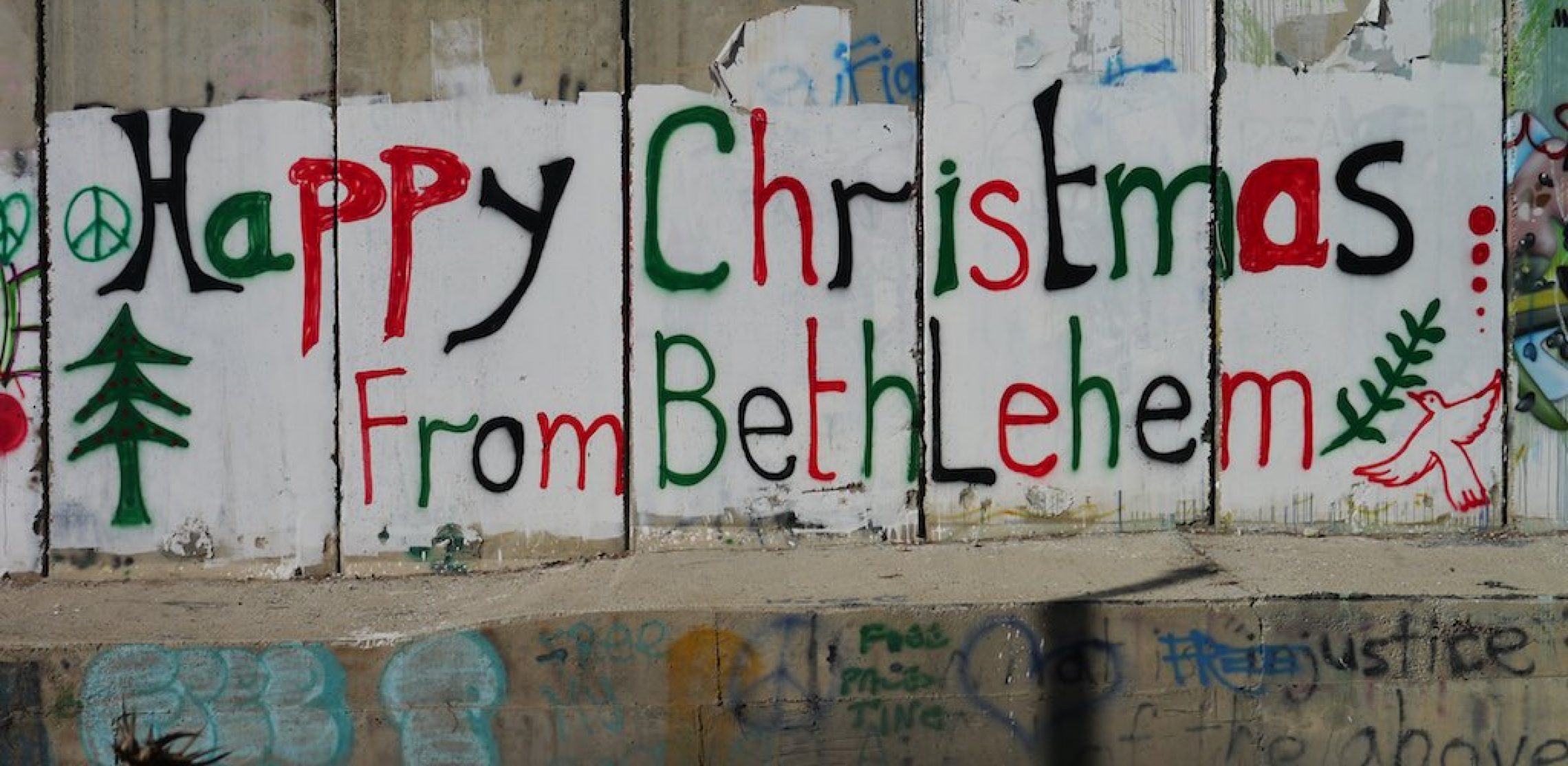 Graffiti an der Mauer in Bethlehem: Happy Christmas